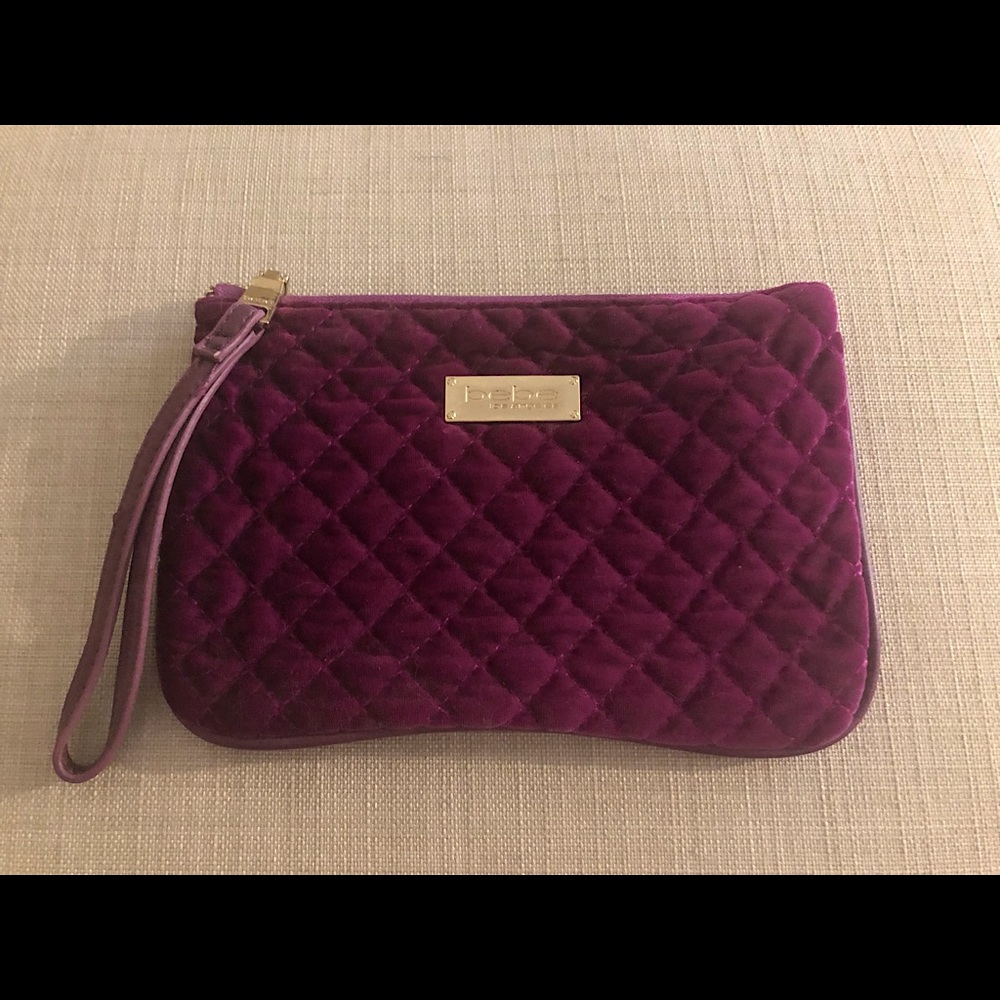 Bebe velvet purple clutch with gold trim. Like new!